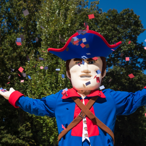 Mascot Jersey Blue Minute Man throwing confetti in to the air